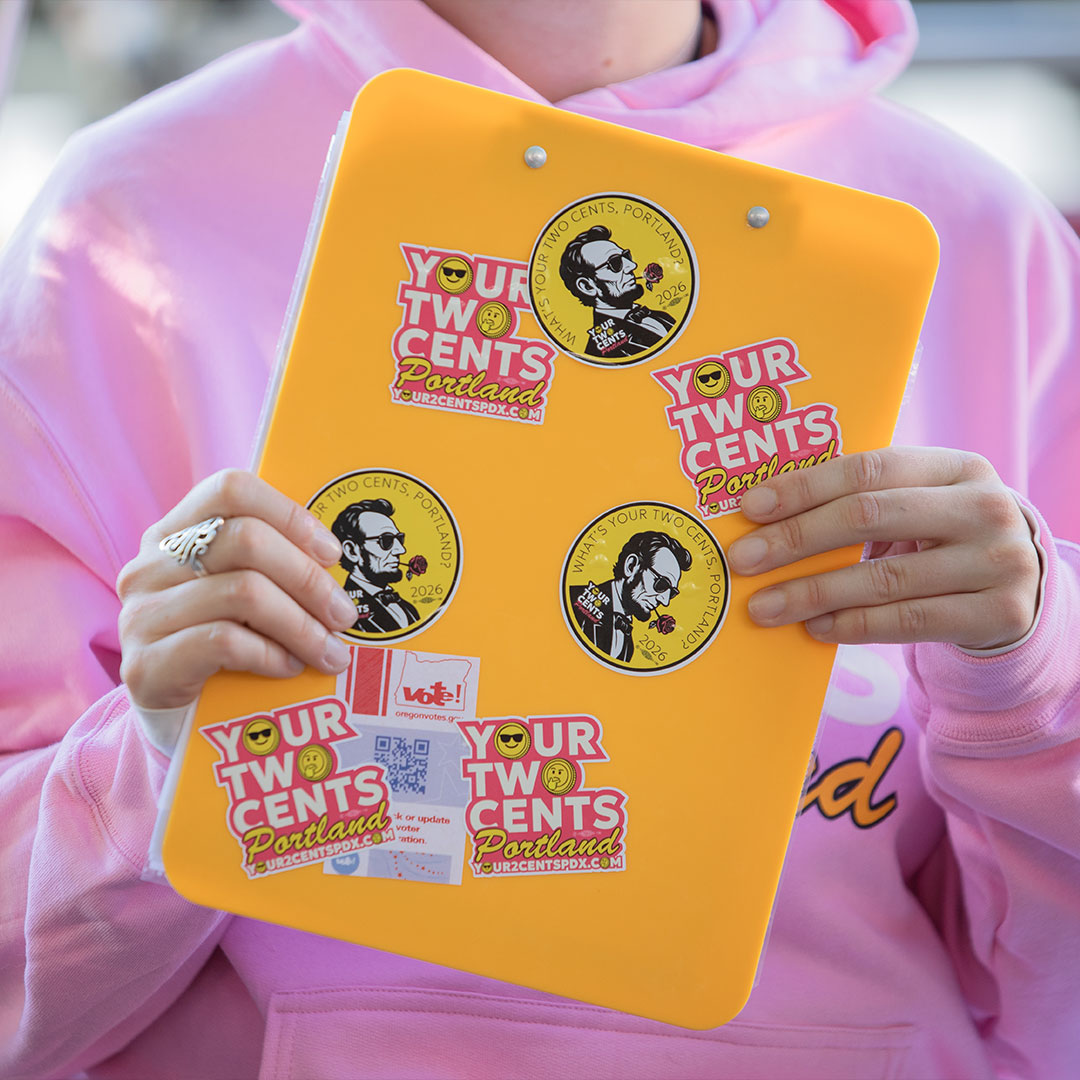 Your 2 Cents Portland volunteer holding a clipboard
